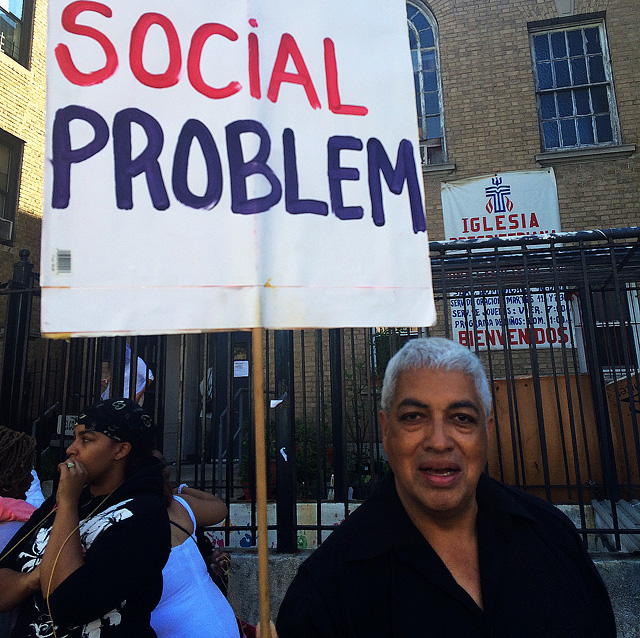 Many men also came to support the cause, carrying signs like this one, ”Domestic Violence is a social problem.”