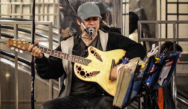 Peter Joseph at 34th Street-Herald Square plays electric guitar, drums, and vocals all at once.